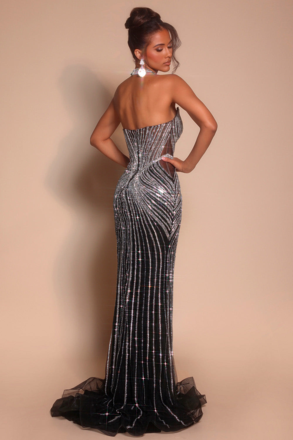 Portia and Scarlett PS26064 Black mermaid prom dress with sequins and a stunning lace-up back, back view.