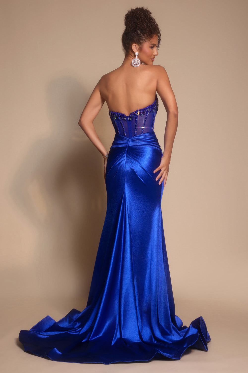 Portia and Scarlett PS26073 Cobalt mermaid prom dress with a lace-up back and beaded bodice, back view.