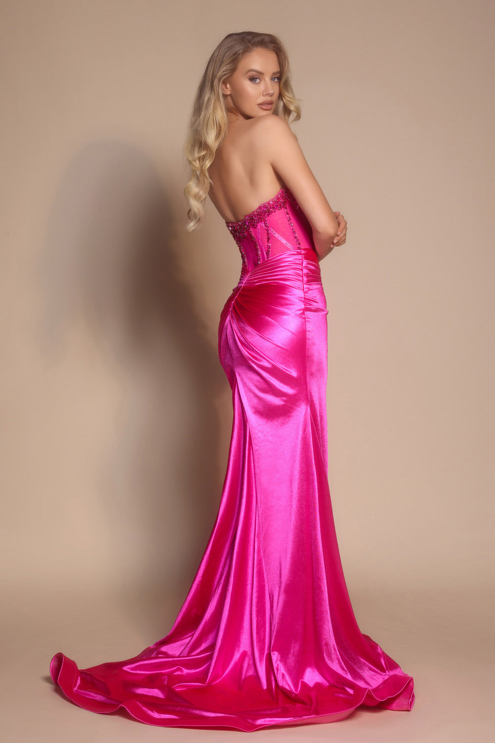 Portia and Scarlett PS26073 Hot pink mermaid prom dress with beaded corset and elegant train, back view.