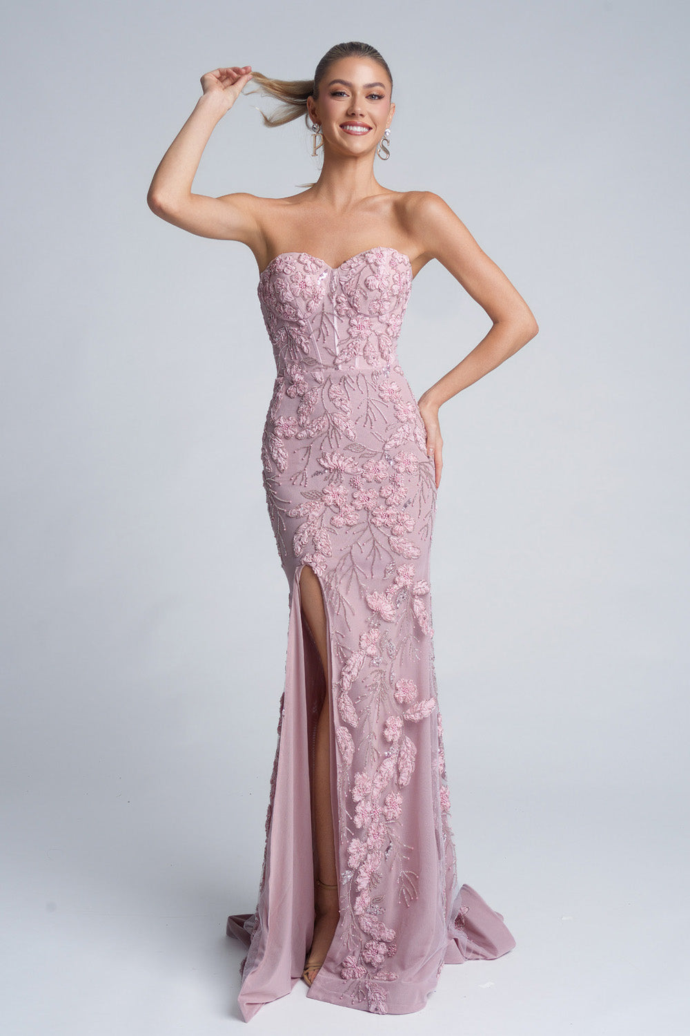 Portia and Scarlett PS26074 Pink mermaid prom dress with floral beading and a thigh-high slit, front view.
