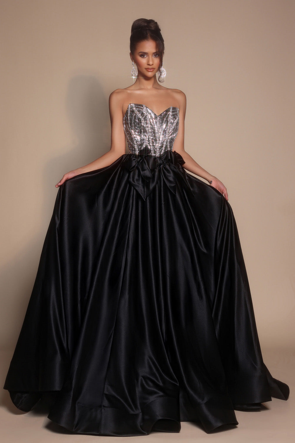 Portia and Scarlett PS26077 Black and silver prom dress with a fitted bodice and flowing ballgown skirt.