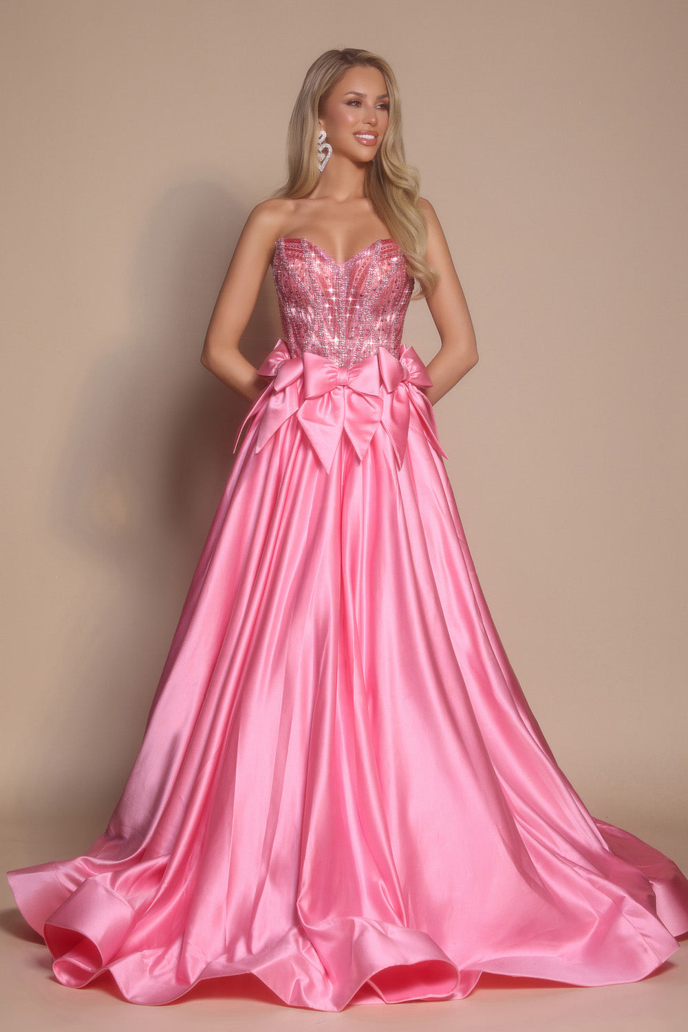Portia and Scarlett PS26077 Fuchsia prom dress with a fitted bodice and dramatic bow detail at the waist.