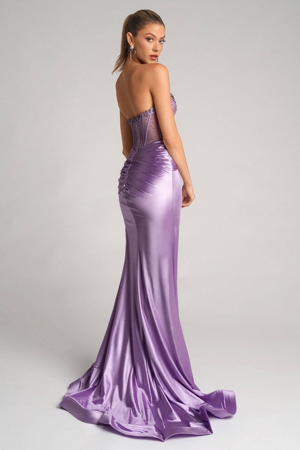Portia and Scarlett PS26085 Lilac mermaid prom dress with a stunning lace-up back and ruched detailing.