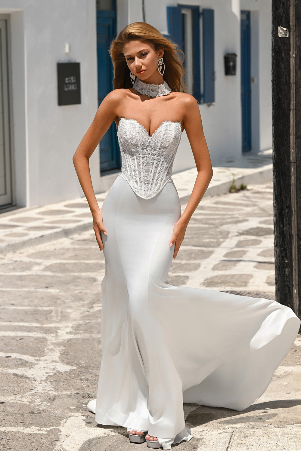 Portia and Scarlett PS26086 Ivory mermaid prom dress with intricate beading and a sweetheart neckline.
