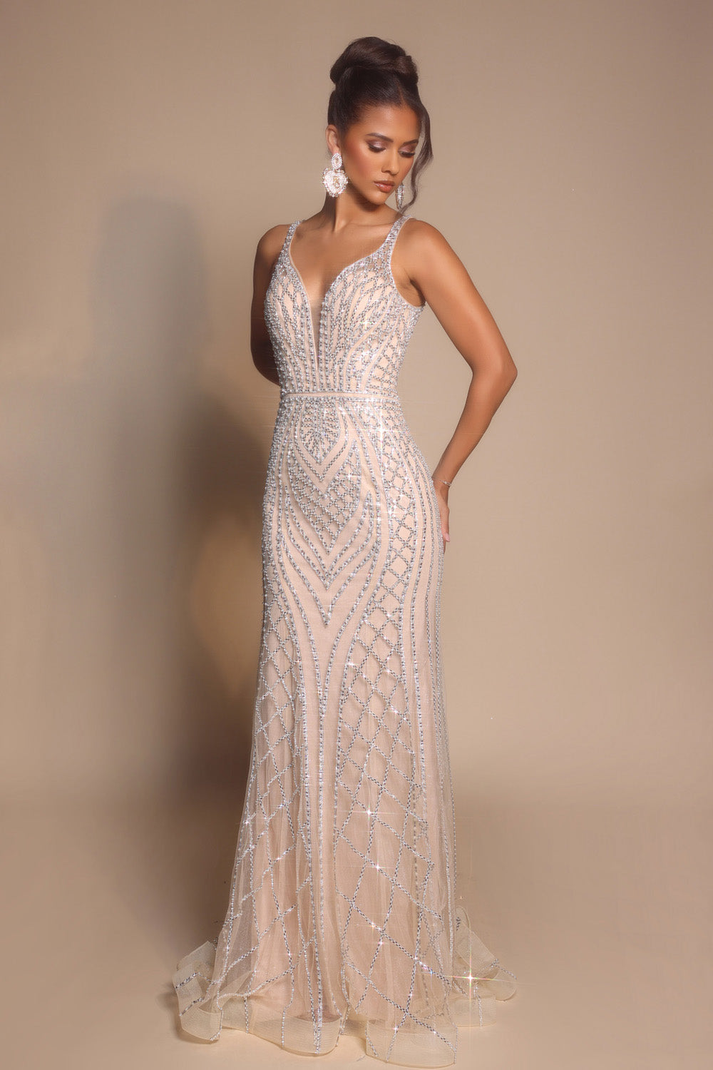 Portia and Scarlett PS26089 Champagne mermaid prom dress with intricate beading and a plunging neckline.