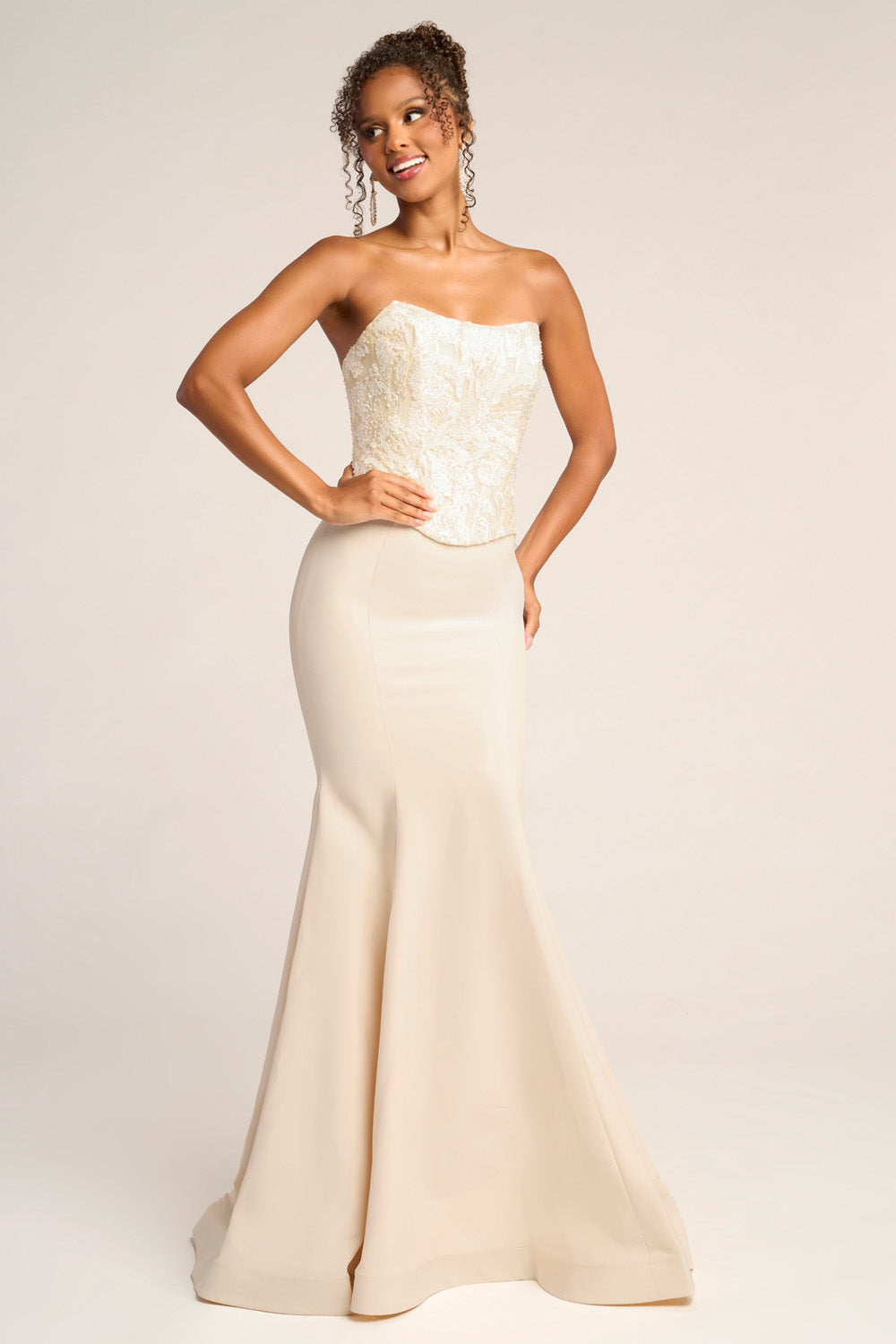 Portia and Scarlett PS26092 Cream mermaid prom dress with intricate beading and a strapless design.