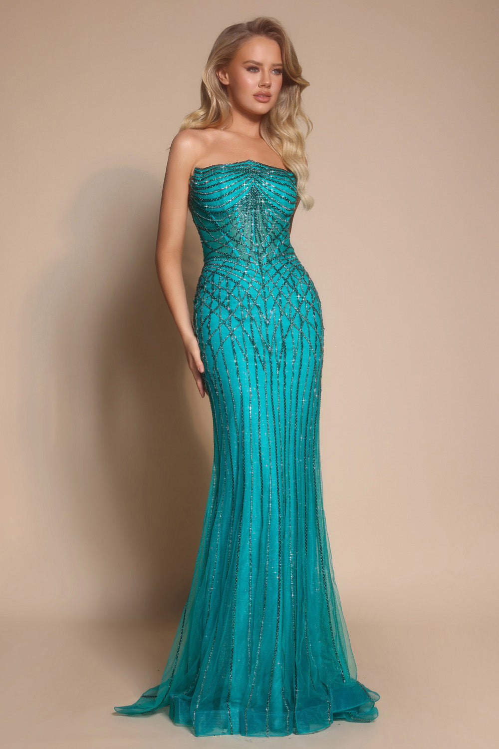 Portia and Scarlett PS26130 Strapless peacock prom dress with mermaid silhouette and intricate beading.