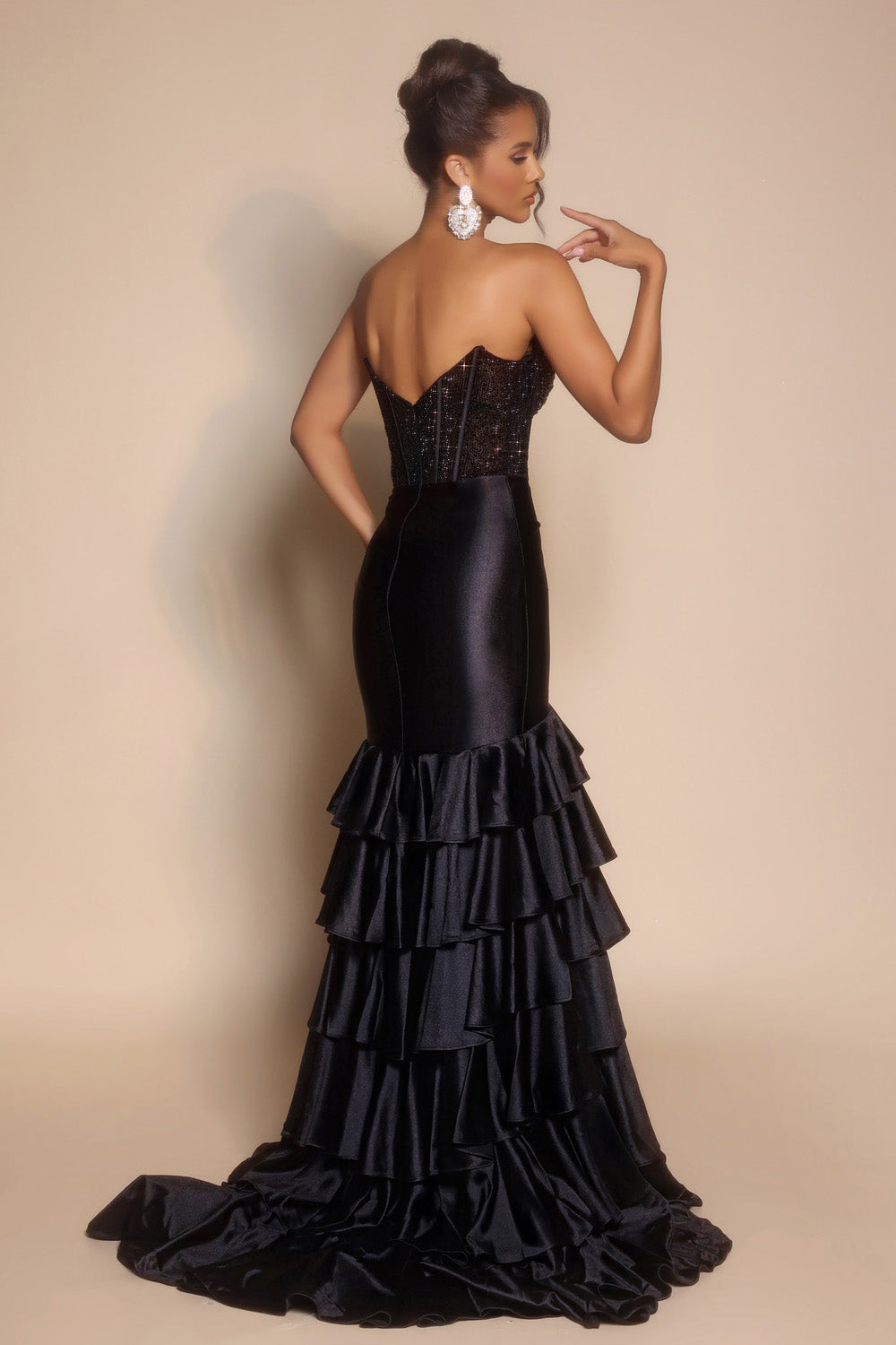 Portia and Scarlett PS26141 Black mermaid prom dress with sequins and ruffled train, back view.