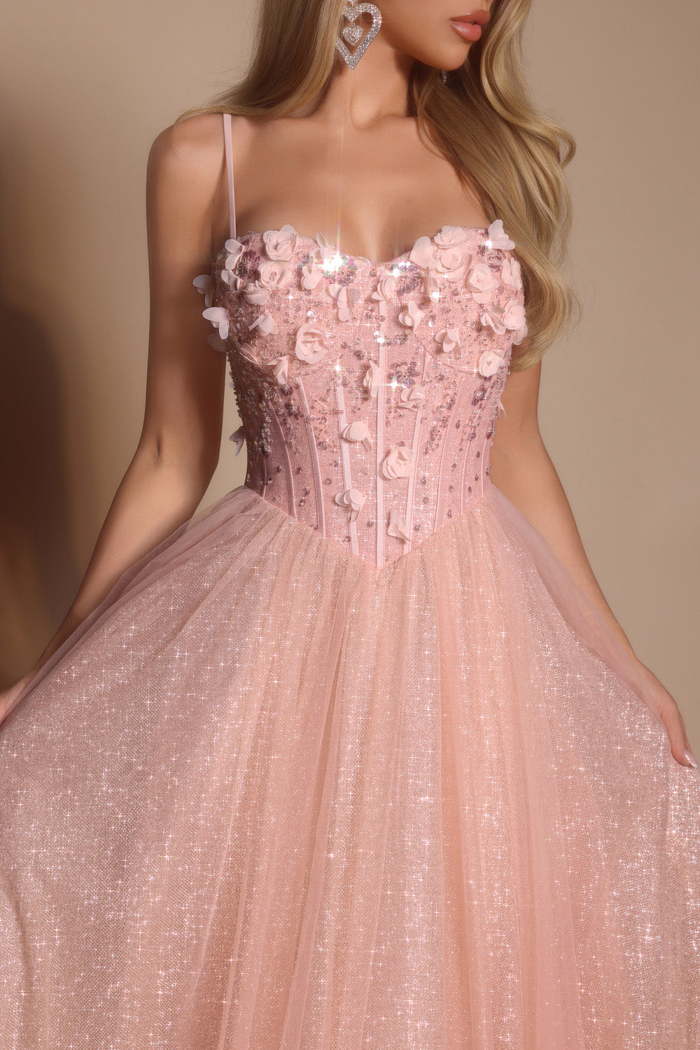 Portia and Scarlett PS26146 Pink prom dress with a fitted bodice, floral embellishments, and a tulle skirt.