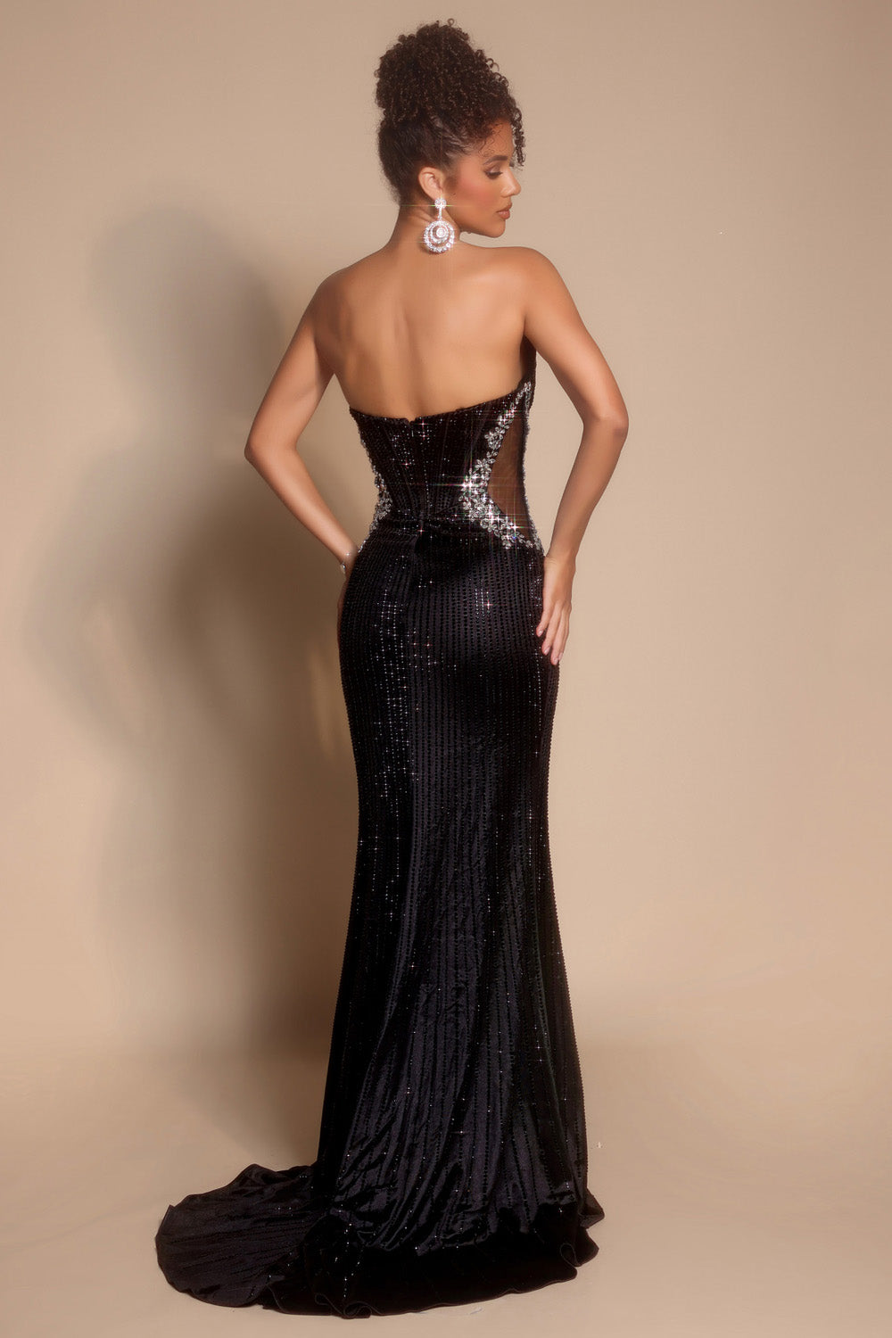 Portia and Scarlett PS26147 Black mermaid prom dress with sequins and a lace-up back, back view.