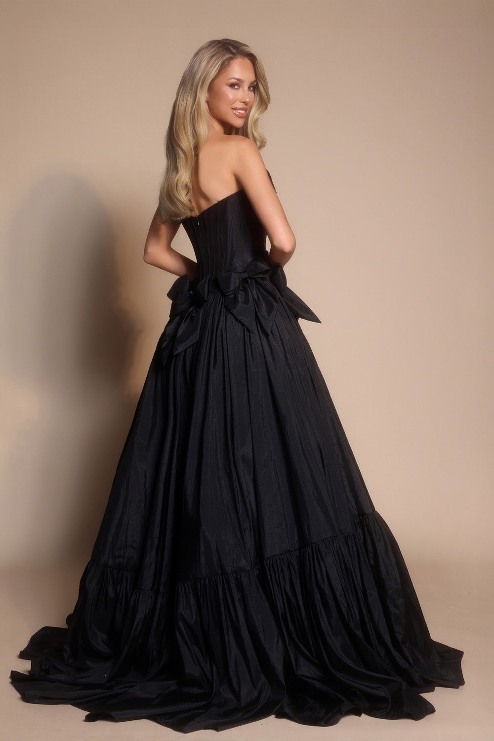 Portia and Scarlett PS26148 Black ballgown prom dress with a corset back and dramatic bow detail.