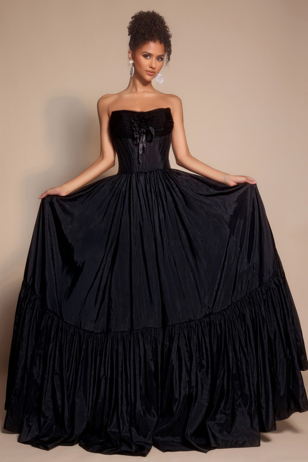 Portia and Scarlett PS26148 Black strapless ballgown with a ruffled skirt and lace-up back, perfect for prom prom dress.