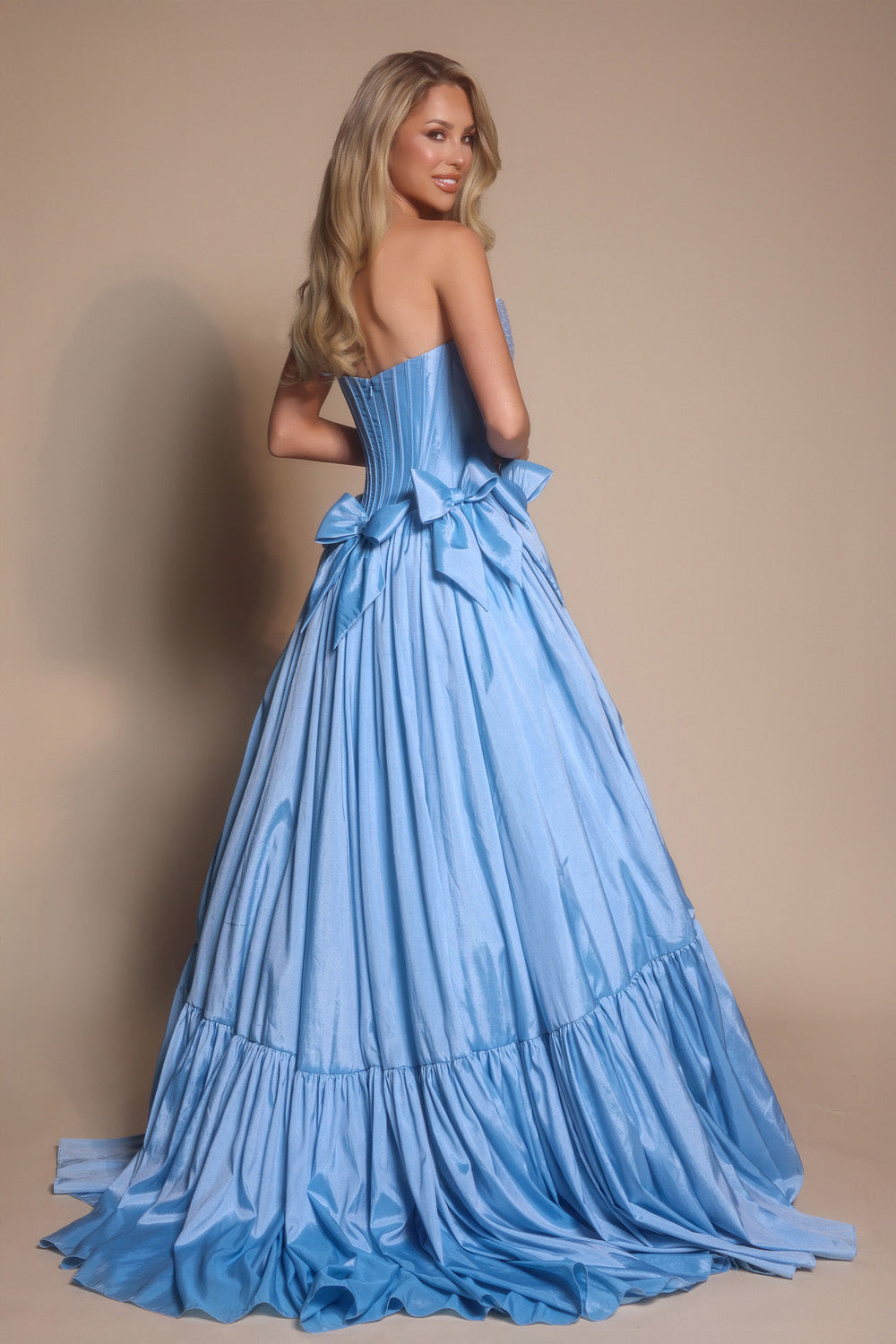 Portia and Scarlett PS26148 Light blue ballgown prom dress with a corset back and dramatic bows.
