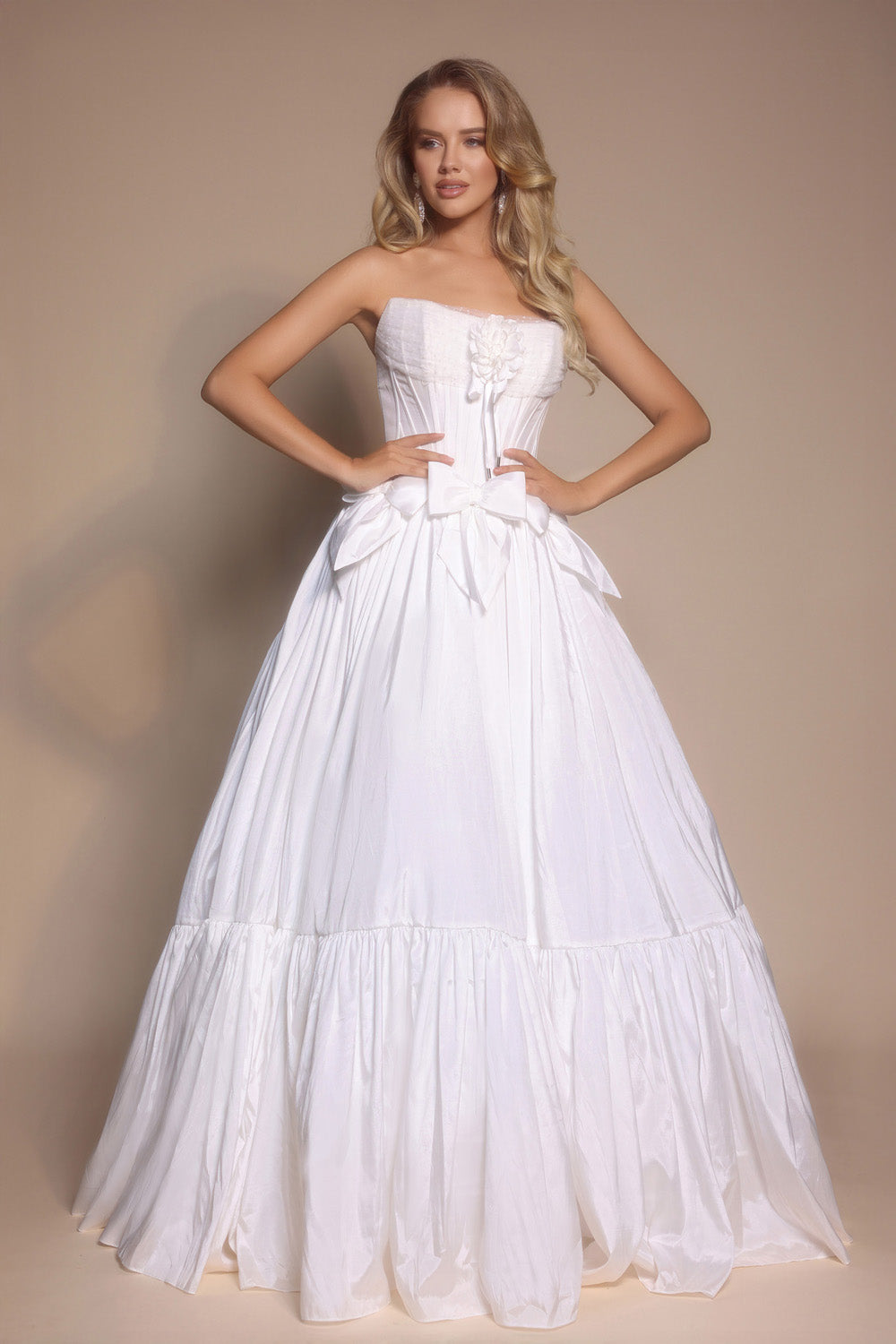 Portia and Scarlett PS26148 Strapless white ballgown with a bow detail and flowing skirt, perfect for prom prom dress.