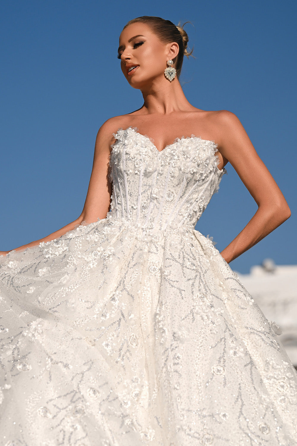 Portia and Scarlett PS26149 Ivory ballgown prom dress with intricate beading and floral embellishments.