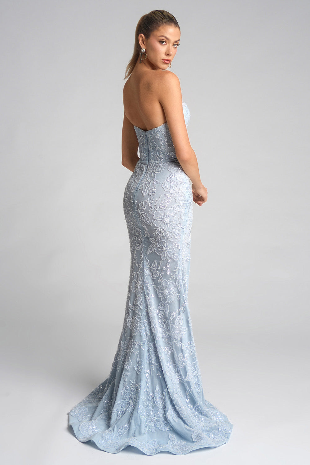 Portia and Scarlett PS26175 Light blue mermaid prom dress with intricate beading, back view.
