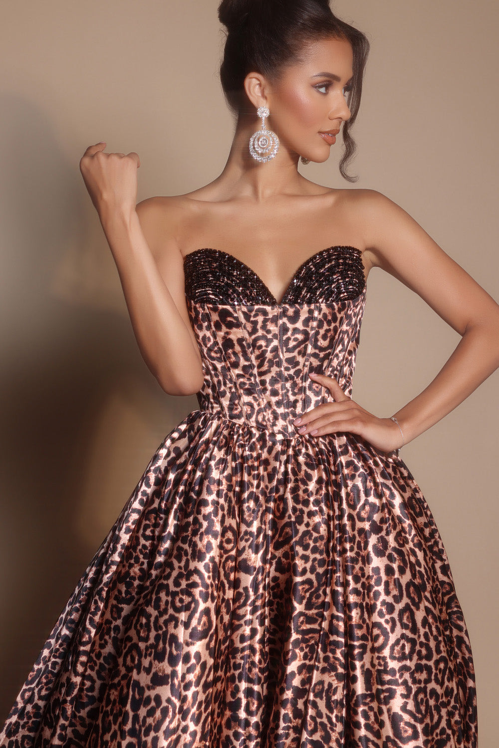 Portia and Scarlett PS26188 Leopard prom dress with a fitted bodice and sparkling beaded neckline.