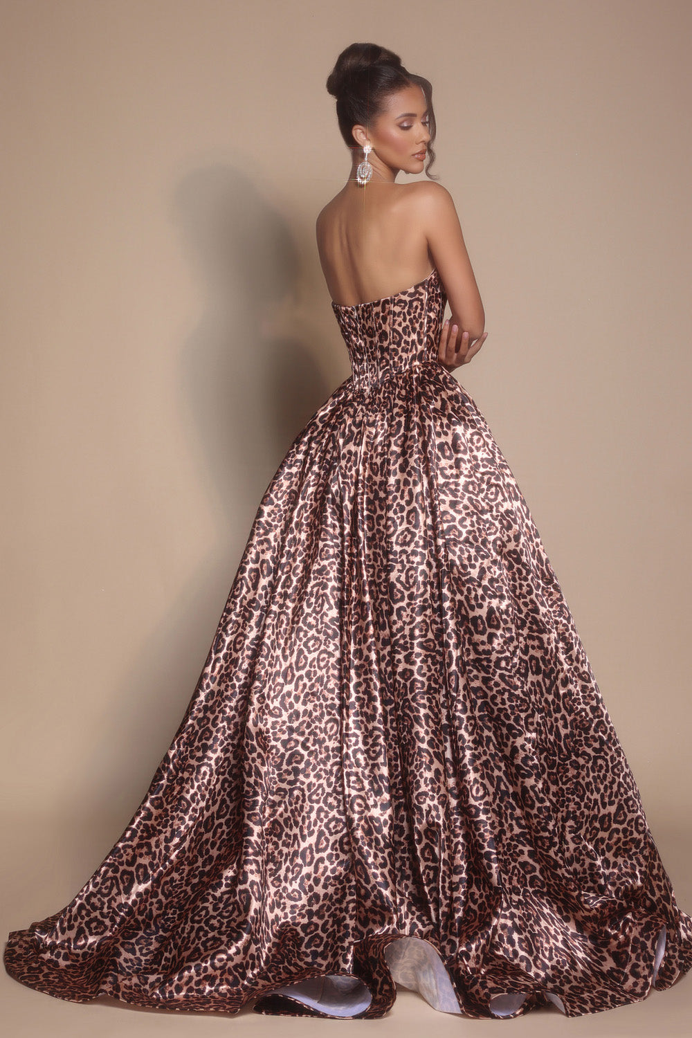 Portia and Scarlett PS26188 Leopard prom dress with a fitted bodice and flowing skirt, featuring a corset back.