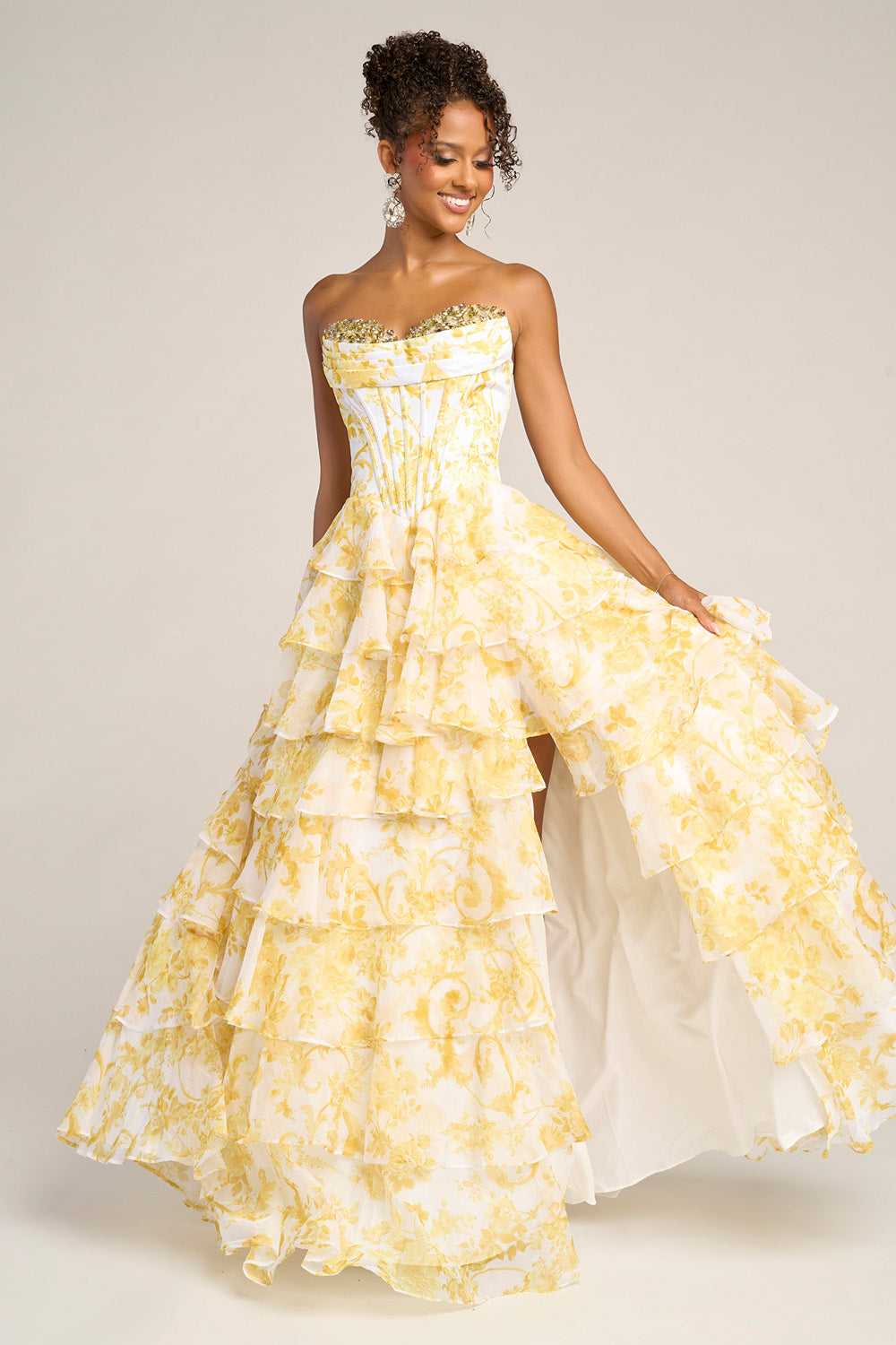 Portia and Scarlett PS26210 Yellow prom dress with a tiered skirt and a high slit, featuring a beaded bodice.