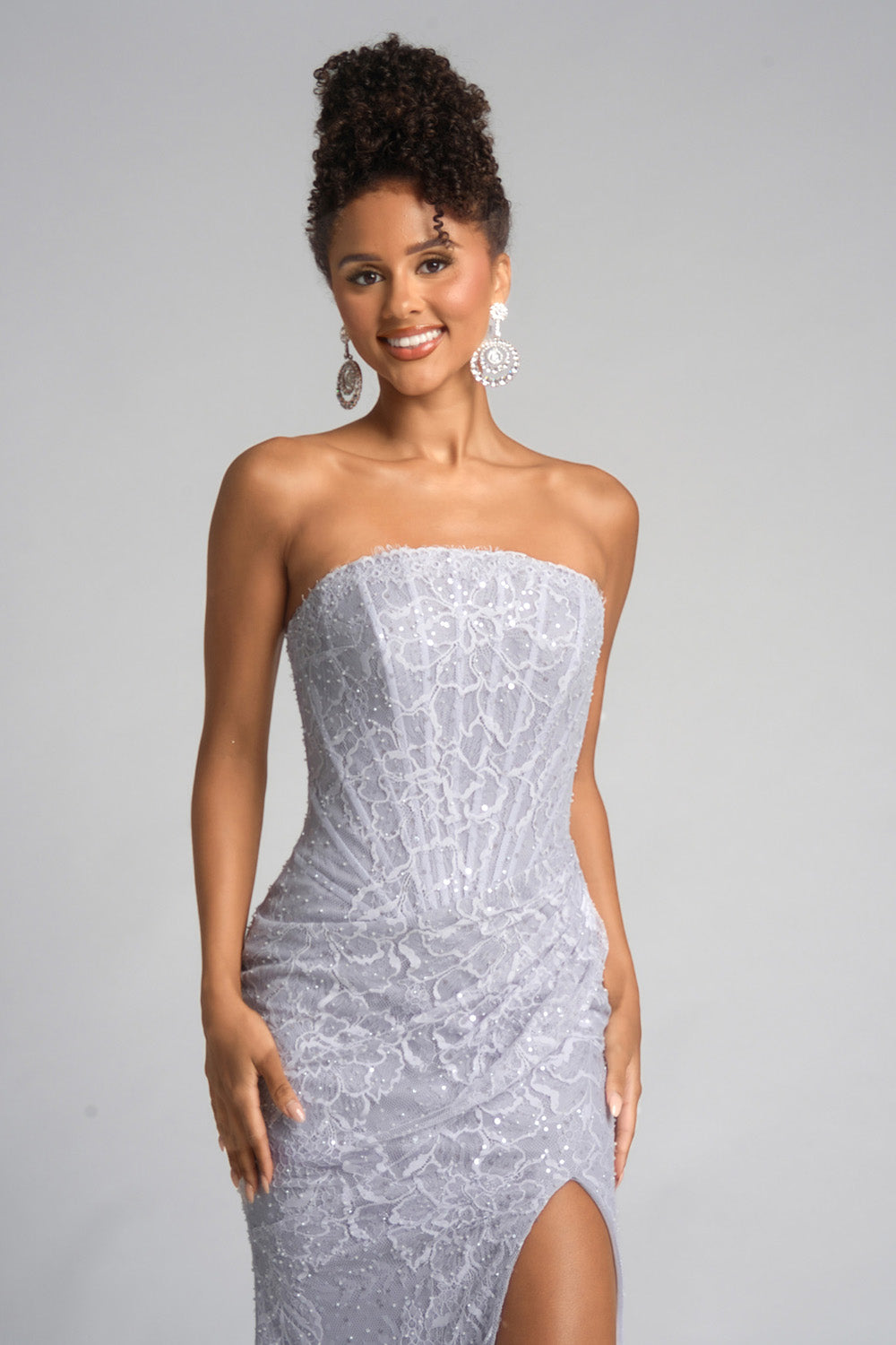 Portia and Scarlett PS26223 Silver mermaid prom dress with sequins and a thigh-high slit, front view.