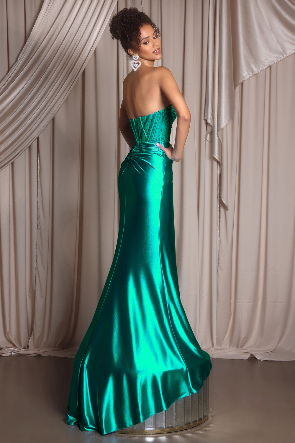 Portia and Scarlett PS26228 Emerald mermaid prom dress with a stunning lace-up back, back view.