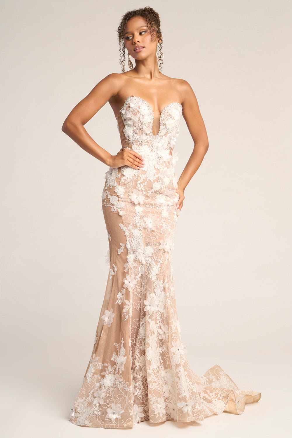 Portia and Scarlett PS26248 Nude pink mermaid prom dress with floral lace and a plunging neckline.