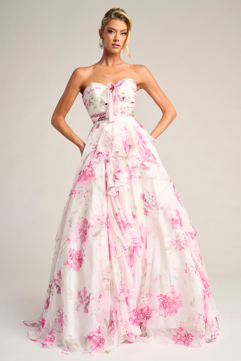 Portia and Scarlett PS26254 Strapless white and pink floral prom dress with ruffled layers and a flowing silhouette.