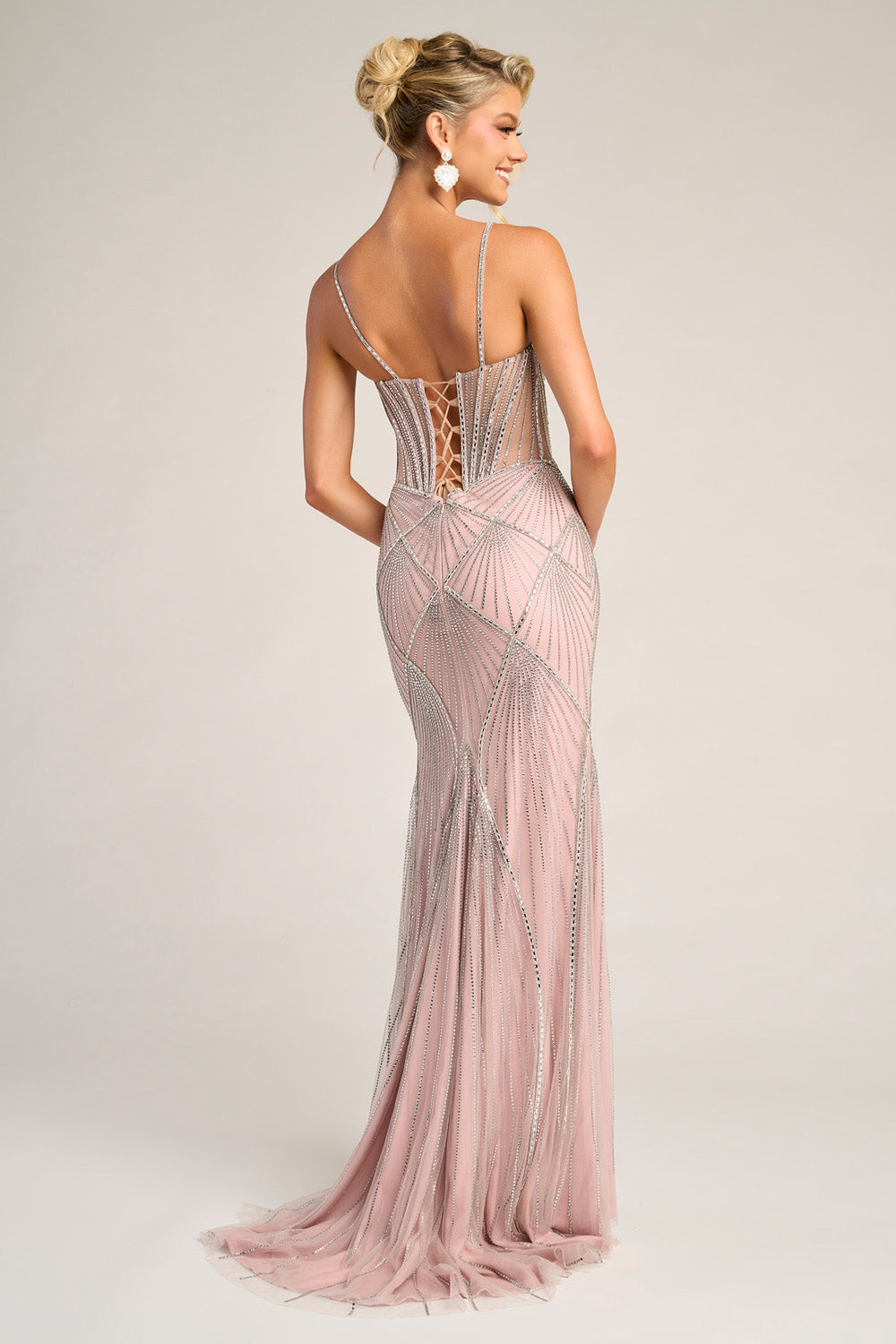 Portia and Scarlett PS26263 Blush mermaid prom dress with intricate beading and lace-up back, back view.