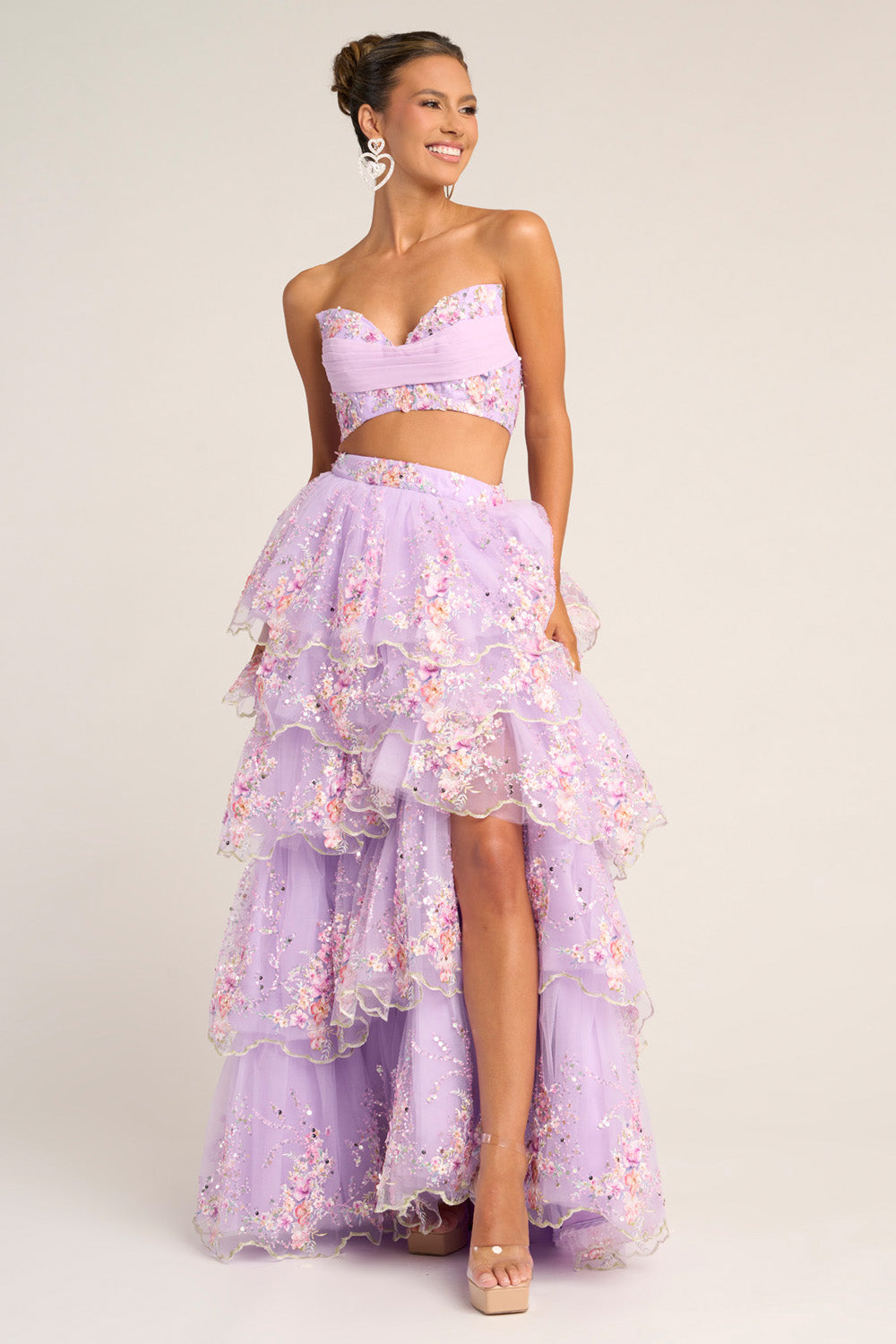 Portia and Scarlett PS26272 Lilac prom dress with a tiered skirt and side slit, featuring floral embellishments.