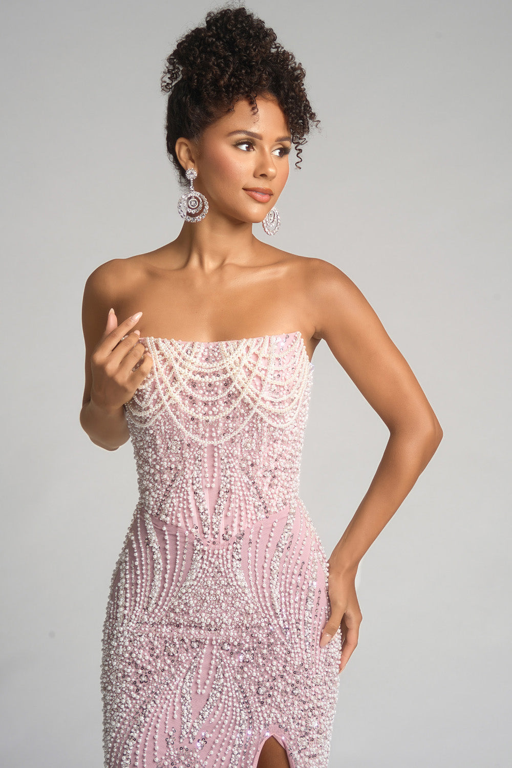 Portia and Scarlett PS26277 Pink mermaid prom dress with beading and a thigh-high slit, front view.