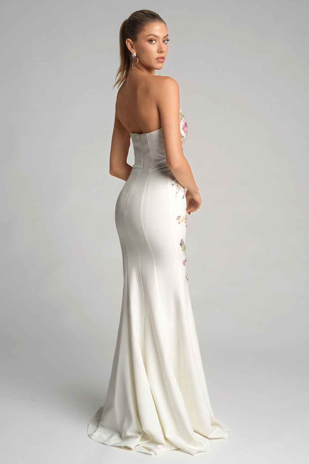 Portia and Scarlett PS26286 Ivory mermaid prom dress with floral embellishments and a fitted silhouette.