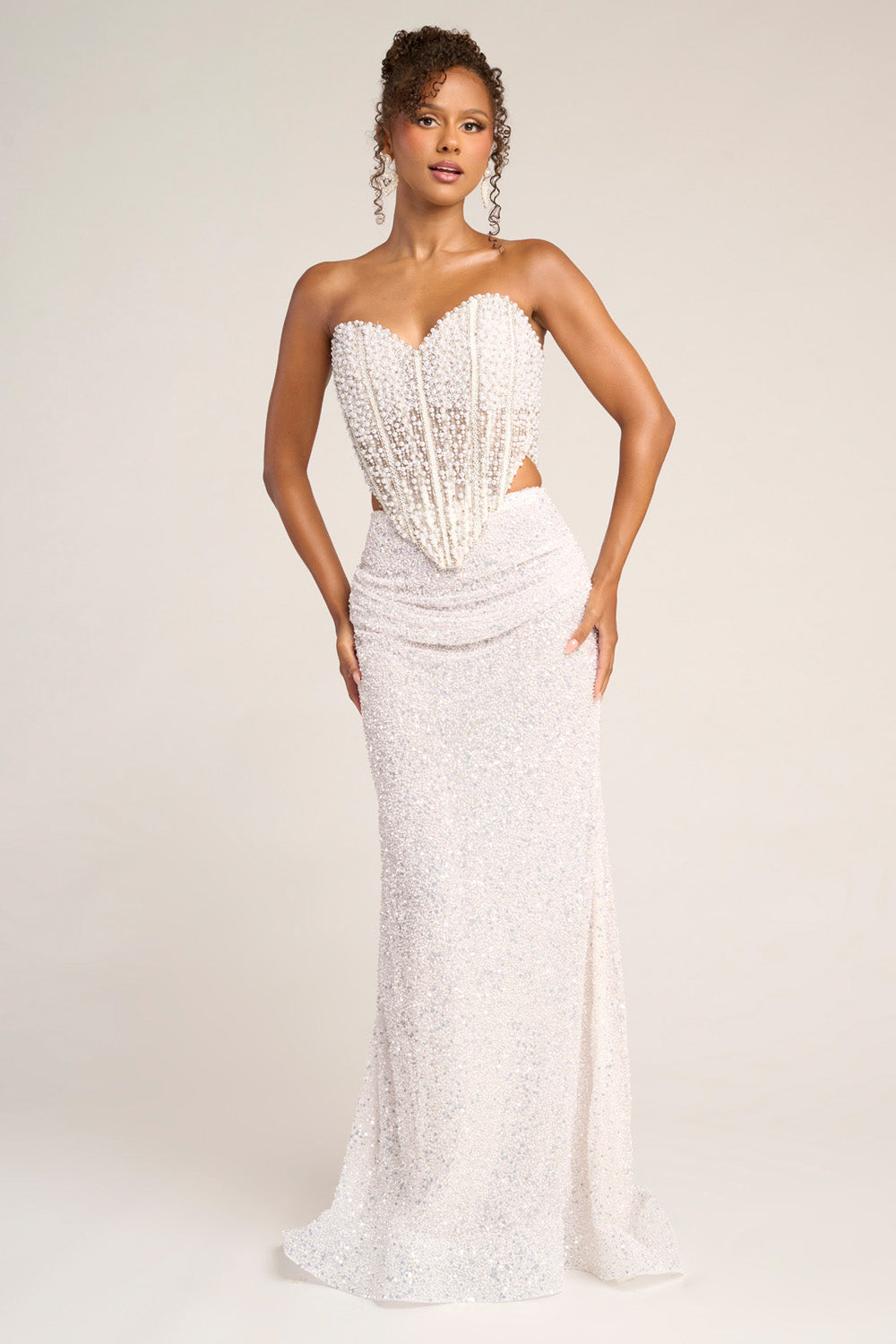 Portia and Scarlett PS26326e Ivory mermaid prom dress with beaded bodice and side slit detail.
