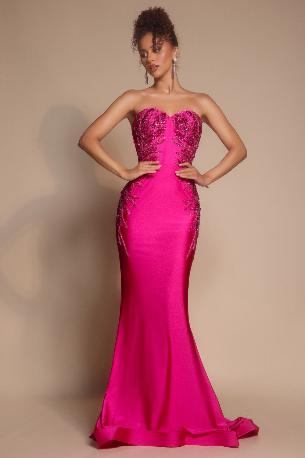 Portia and Scarlett PS26331e Hot pink mermaid prom dress with intricate beading and a strapless neckline.