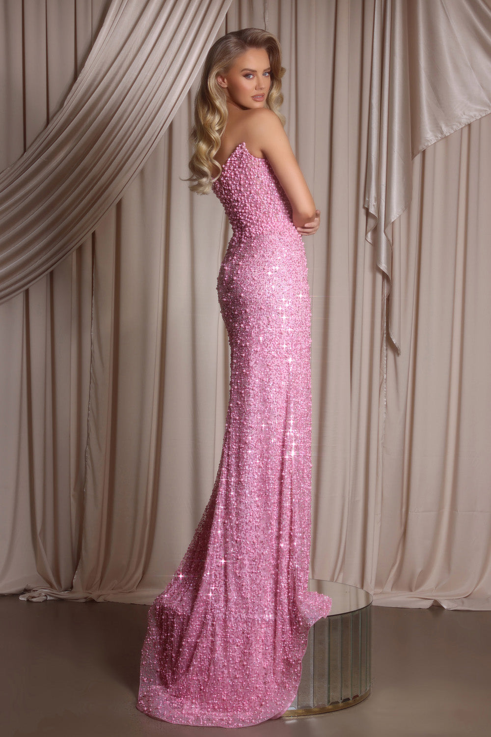 Portia and Scarlett PS26400c Pink mermaid prom dress with sequins and a fitted silhouette, side view.