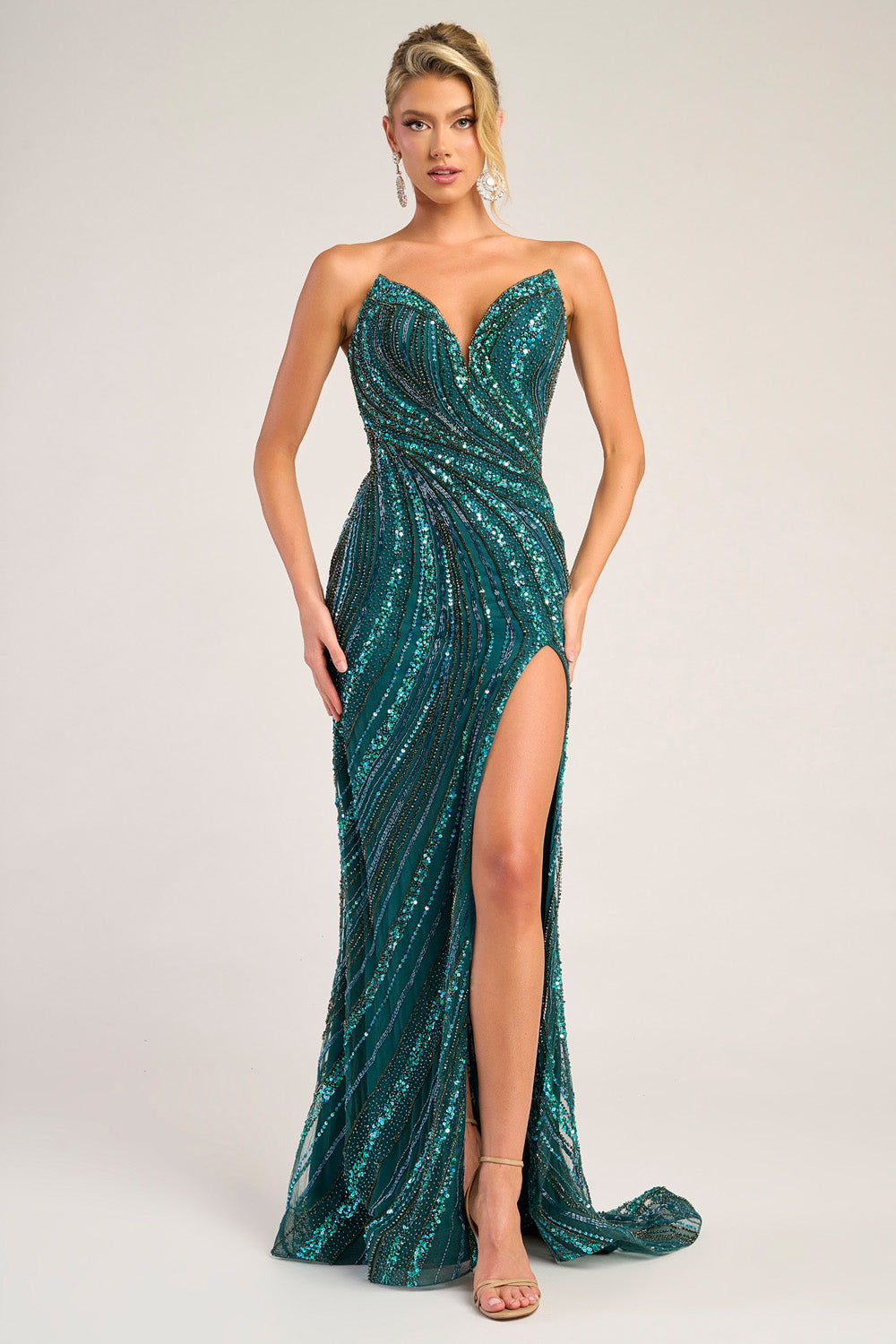 Portia and Scarlett PS26412c Teal mermaid prom dress with a thigh-high slit and shimmering sequins.
