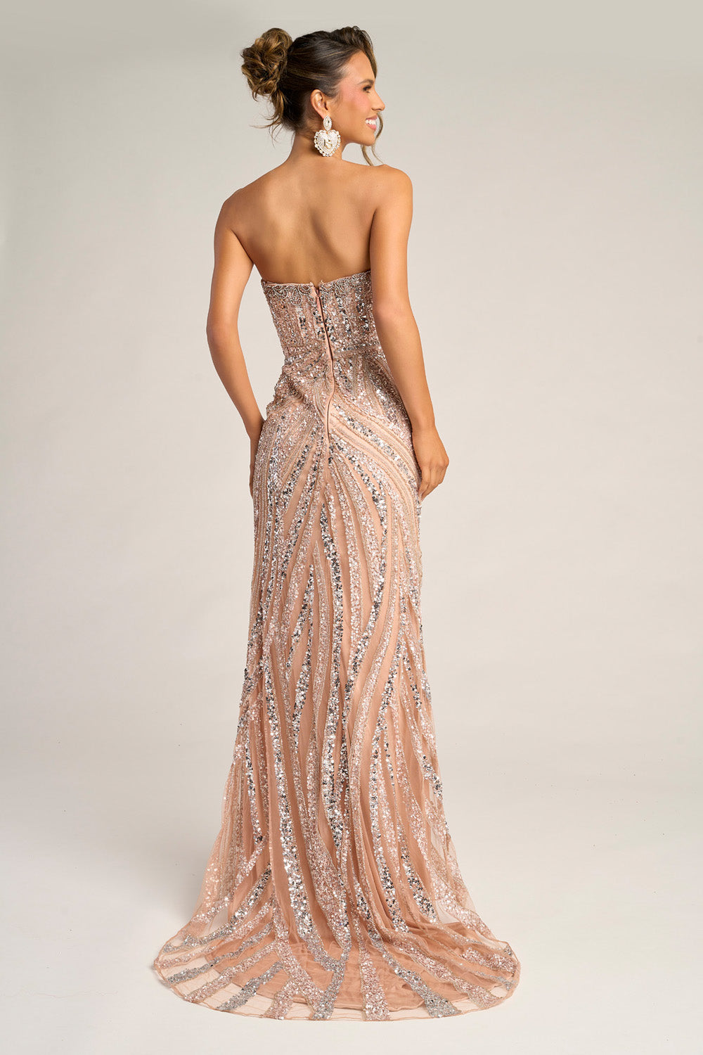 Portia and Scarlett PS26418c Rose gold silver mermaid prom dress with sequins and a lace-up back, back view.
