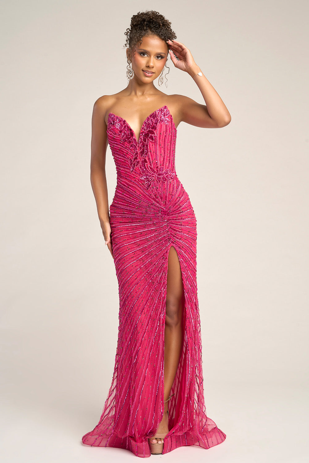 Portia and Scarlett PS26422c Fuchsia mermaid prom dress with beading and a thigh-high slit, front view.
