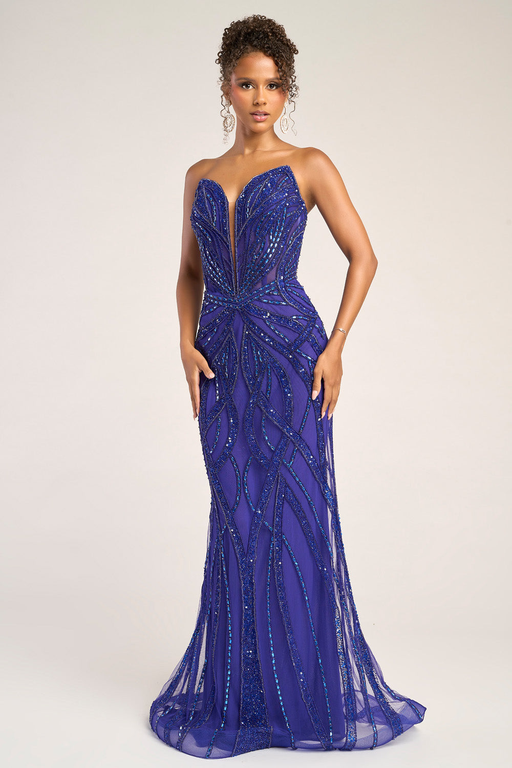 Portia and Scarlett PS26423c Cobalt mermaid prom dress with intricate beading and a plunging neckline.