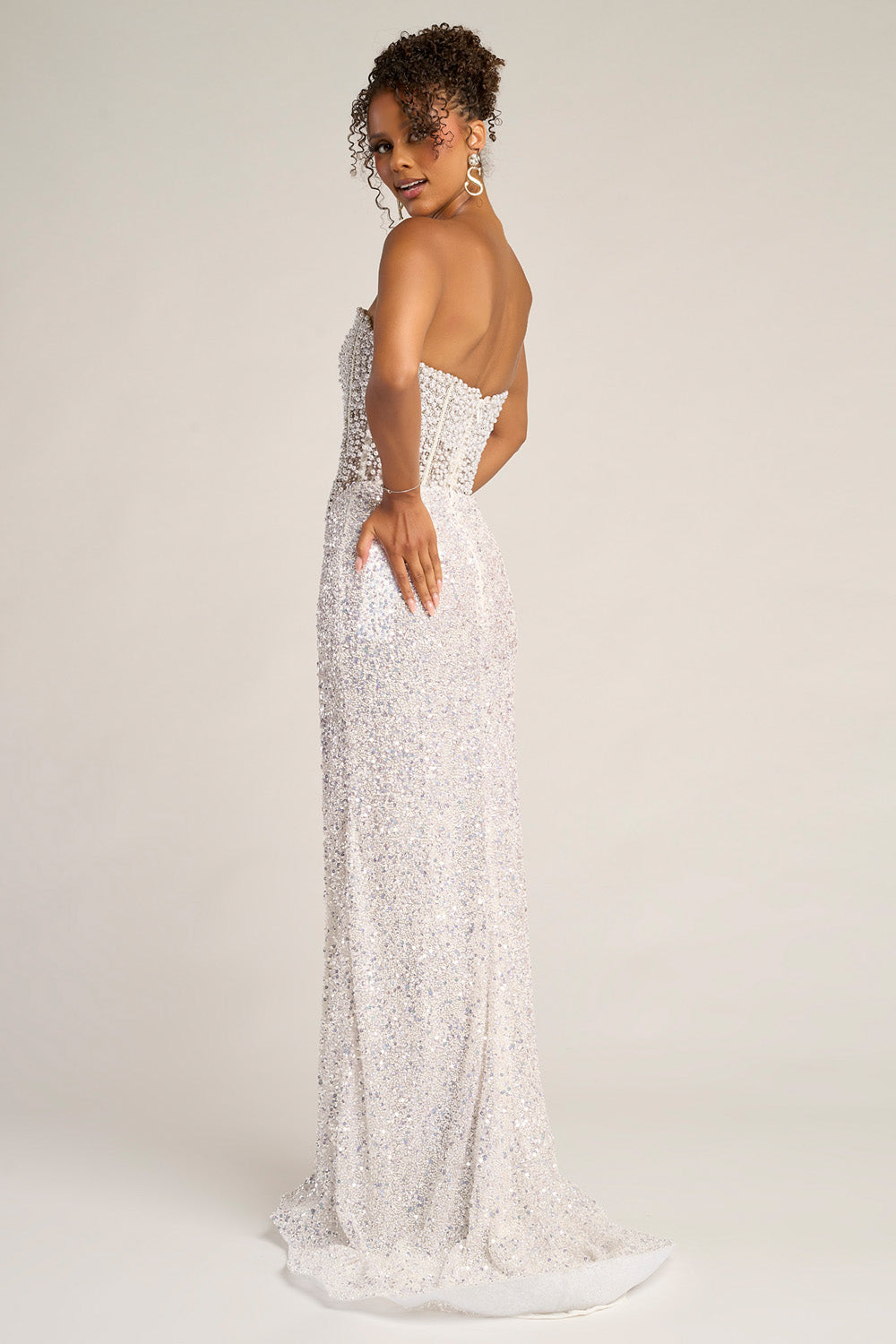 Portia and Scarlett PS26432c White mermaid prom dress with sequins and a lace-up back, back view.
