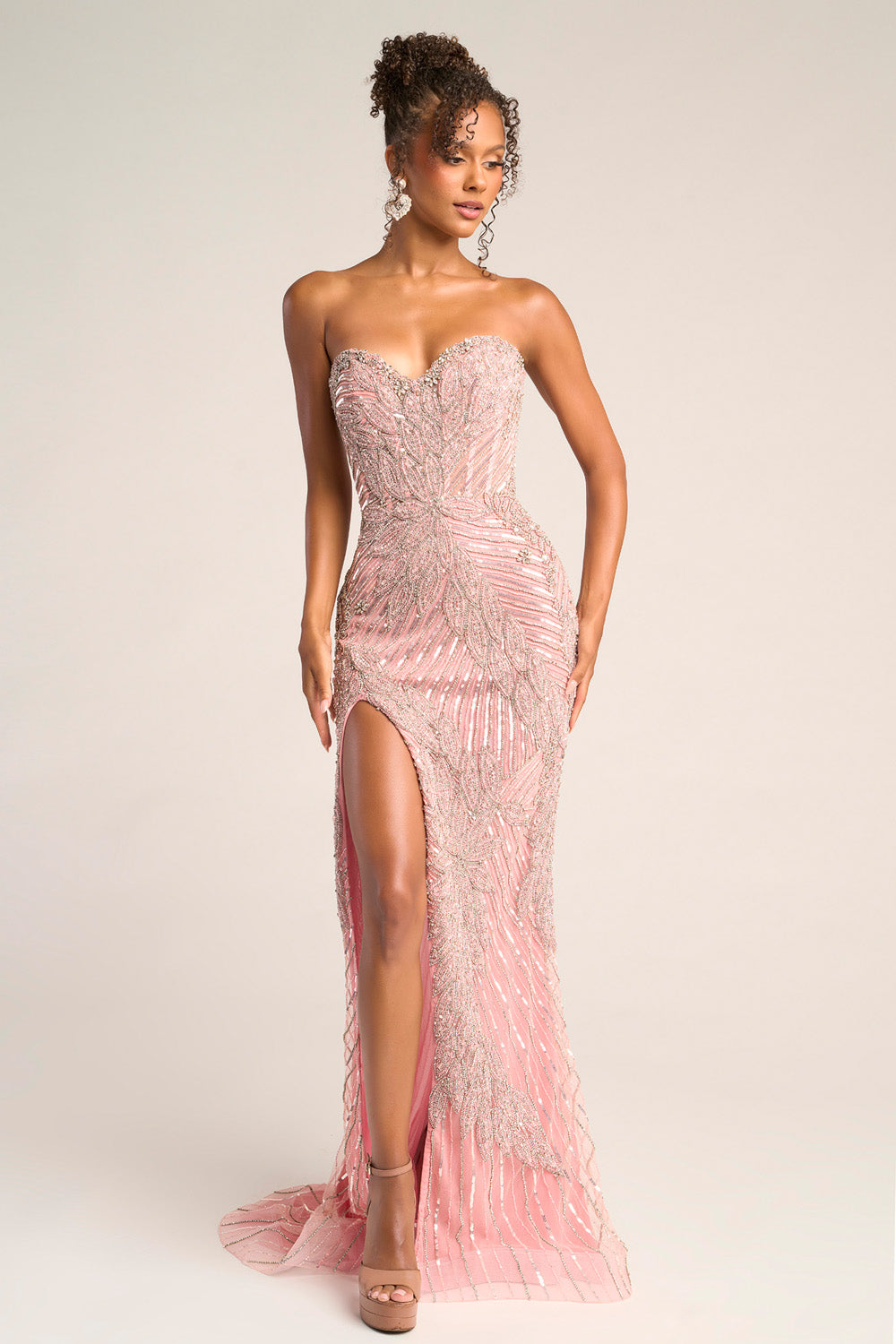 Portia and Scarlett PS26435c Pink silver mermaid prom dress with beading and a thigh-high slit, front view.