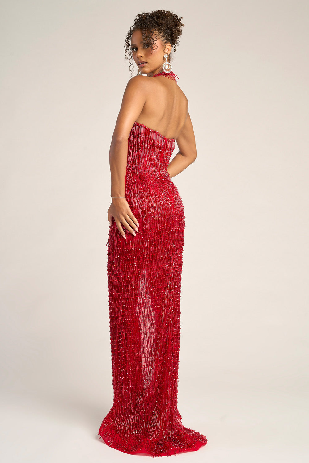 Portia and Scarlett PS26452c Red fitted prom dress with sequins and a side slit, back view.