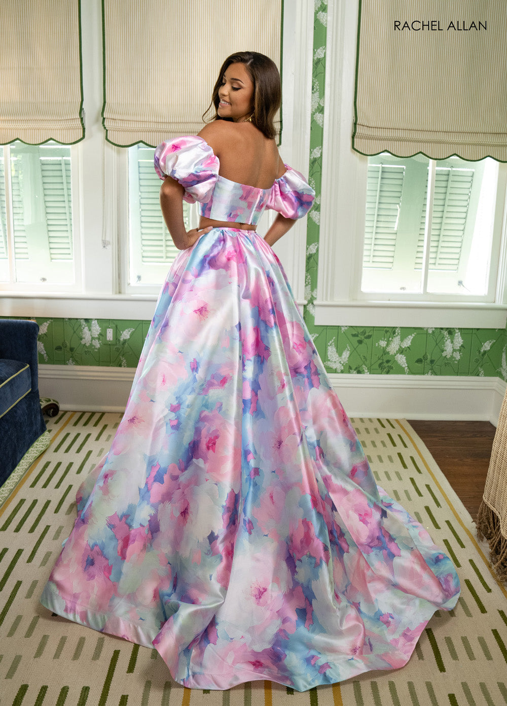 Rachel Allan 70921 Pink multi formal gown with puff sleeves and a flowing A-line silhouette.