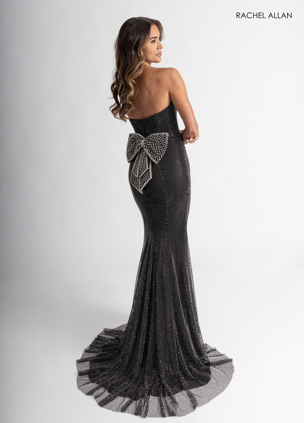 Rachel Allan 70936 Black mermaid prom dress with crystal beading and a lace-up back detail.
