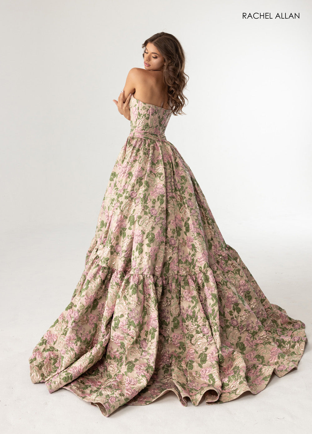 Rachel Allan 70939 Strapless pink floral ballgown with a tiered skirt, perfect for prom prom dress.