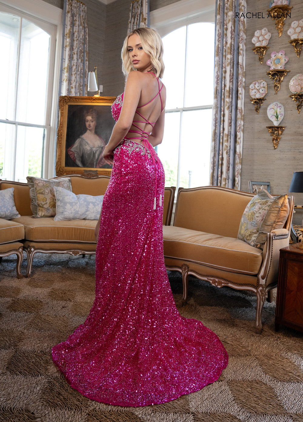 Rachel Allan 70941 Fuchsia mermaid prom dress with crystal beading and lace-up back, back view.