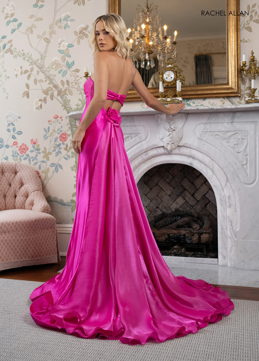 Rachel Allan 70945 Hot pink formal gown with a lace-up back and flowing tiered ruffle skirt.