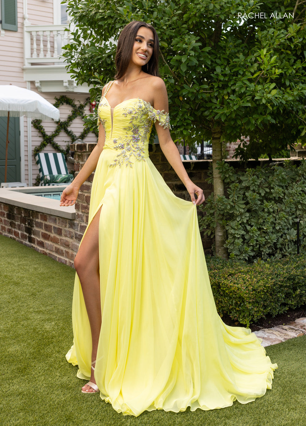 Rachel Allan 70951 Yellow chiffon prom dress with a high slit and crystal beading, front view.