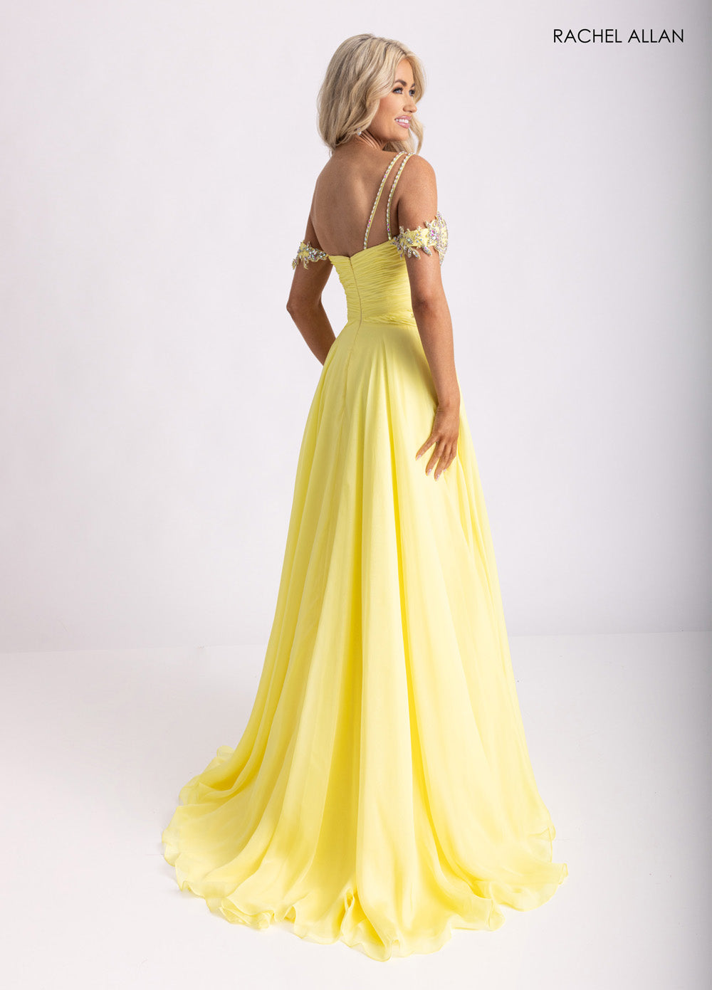 Rachel Allan 70951 Yellow A-line prom dress with crystal beading and off-shoulder straps, back view.