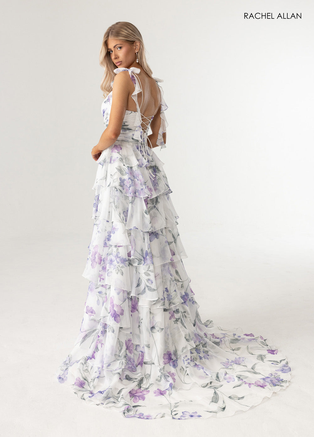 Rachel Allan 70953 Floral print prom dress in white with a lace-up back and tiered ruffle skirt.