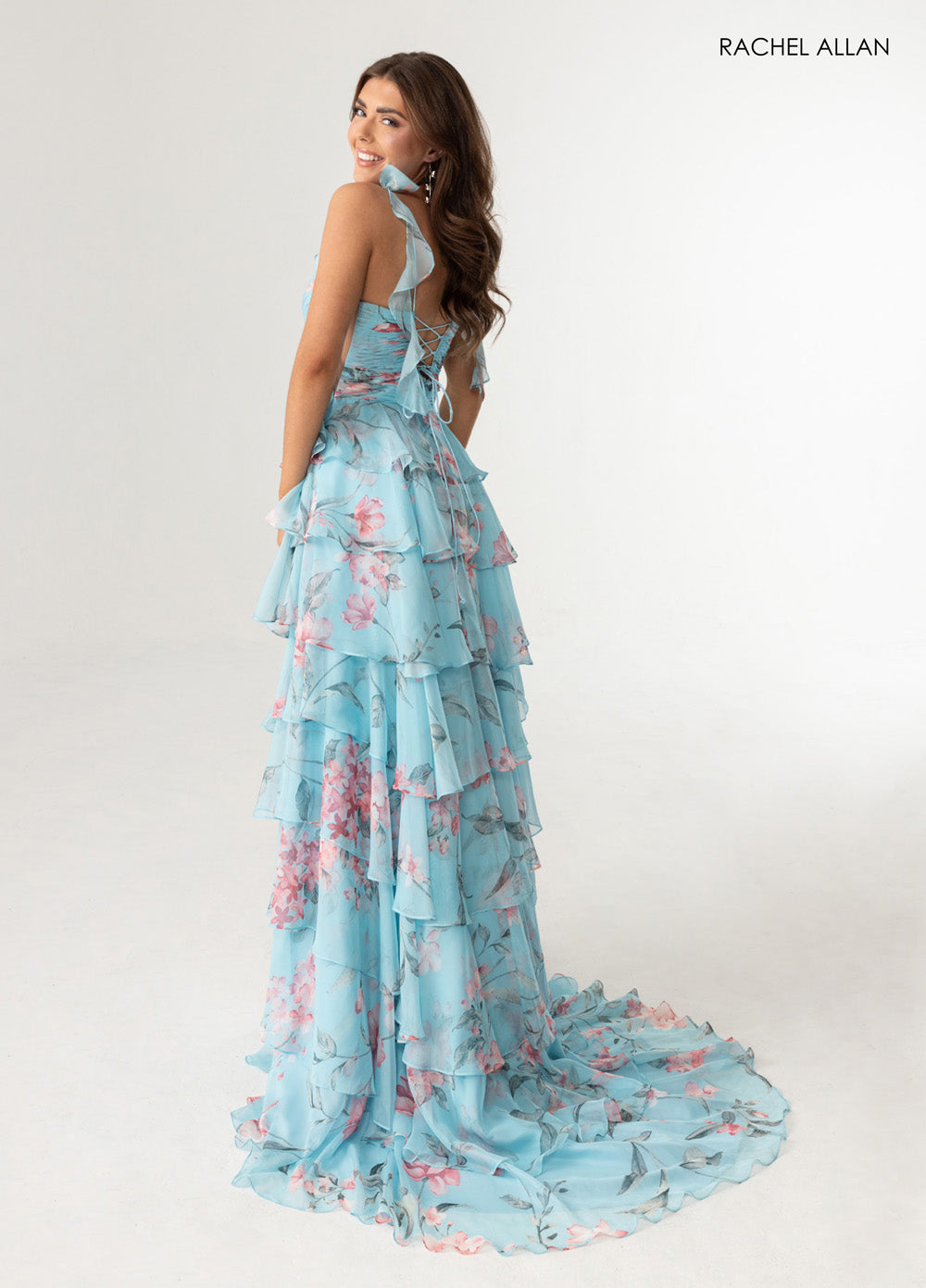Rachel Allan 70953 Sky blue multi prom dress with ruffled layers and lace-up back, back view.